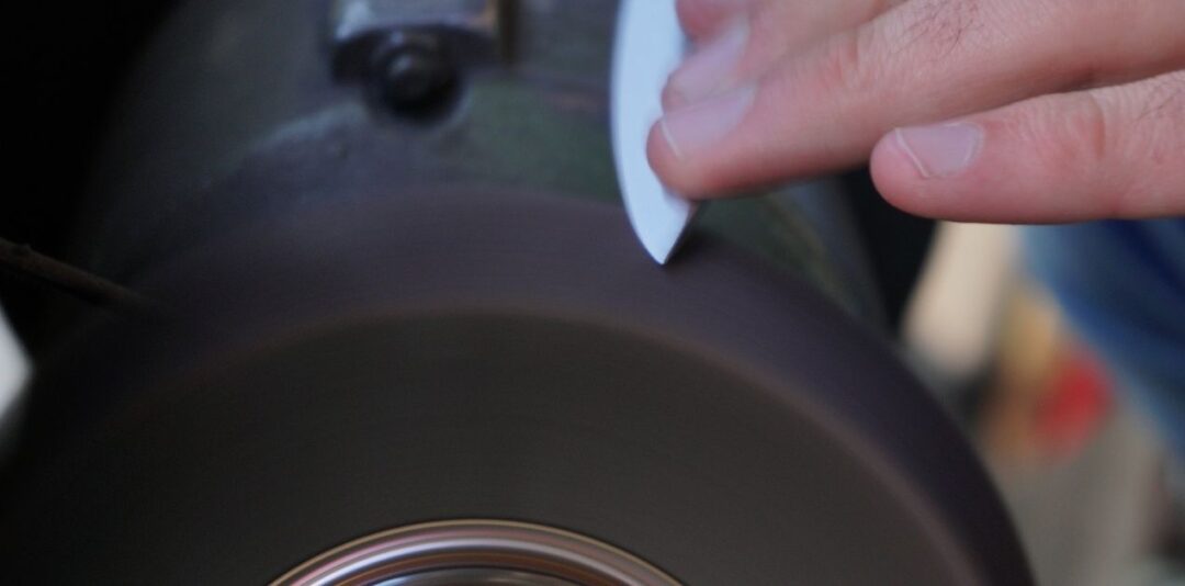 How to Sharpen Lawn Mower Blades with a Bench Grinder